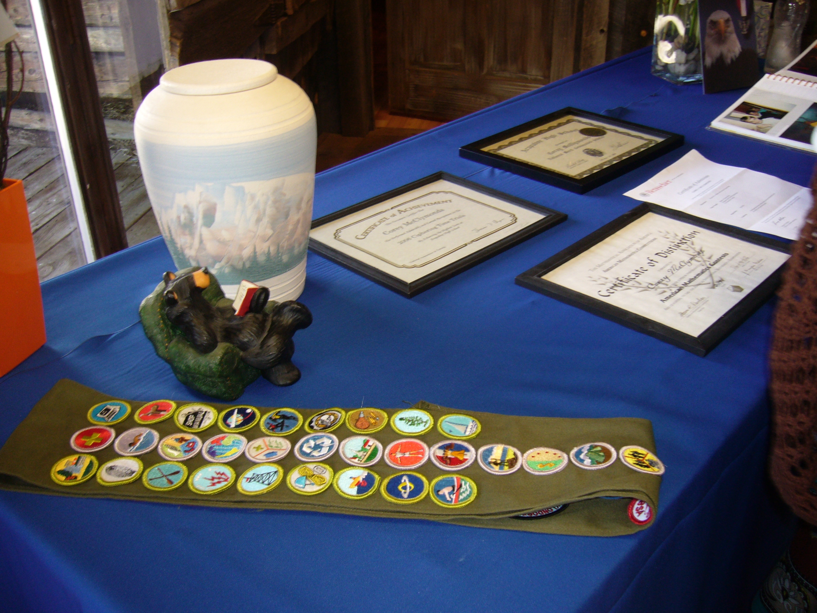 Corey McClymonds Table of Awards and his Urn image